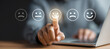 © Ployker - a man using a laptop, his finger pointing to a virtual smiley face with various emotion signs like happy, sad, or neutral, representing customer experience satisfaction