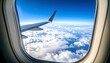 © Farelun - Airplane wing viewed from porthole above fluffy cloudscape under a bright blue sky