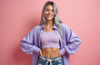 © miss irine - Smiling woman with silver hair poses before pink background. She wears purple shirt with top, denim shorts. Attractive model displays confidence and positive attitude. Youthful, fashionable portrait.