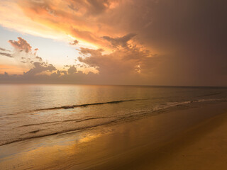 Wall Mural - aerial view amazing cloud in colorful sky at sunset above the ocean.
the sea water reflected from the sky.
Majestic sunset landscape Amazing light of nature.
beautiful sunset cloudscape background.