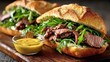© Oleh - Freshly prepared baguette sandwiches bursting with grilled meats, vibrant arugula, and zesty mustard sauce offer a delightful culinary experience perfect for any meal or snack