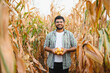 © Serhii - young indian farmer at corn field