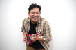 © airdone - Asian man playing ukulele at home
