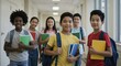 © SimpleDesignStudio - Portrait of a diverse group of happy middle school students standing in a school hallway. Multiethnic classmates with backpacks and books.