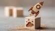 © Dao - Rocket launching from wood cube with business icon, Start-up, Creativity, Big idea, Business goals management, Investment on new project to wealth, Company strategy target, Sustainable financial plan