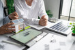 © Charlie's - Solar panels green energy Business man working green eco friendly office business creative idea Planing Bio economy for business eco friendly professional Engineer sustainable electricity.