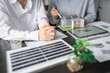 © Charlie's - Solar panels green energy Business man working green eco friendly office business creative idea Planing Bio economy for business eco friendly professional Engineer sustainable electricity.
