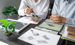 © Charlie's - Solar panels green energy Business man working green eco friendly office business creative idea Planing Bio economy for business eco friendly professional Engineer sustainable electricity.