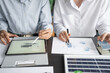 © Charlie's - Solar panels green energy Business man working green eco friendly office business creative idea Planing Bio economy for business eco friendly professional Engineer sustainable electricity.