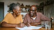 © Johannes - mature couple sitting and managing expenses at home happy african man and woman paying bills and managing budget black smiling couple checking accountancy and bills while looking at each other no log