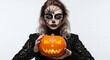 © Choudhry - Spooky Halloween woman with pumpkin and spider web face paint