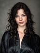 © Johannes - confident woman with dark wavy hair blue eyes fair skin wearing black satin robe natural makeup studio portrait