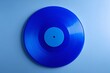 © avaye - Blue vinyl record centered, modern music concept on soft blue background