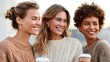 © NovaVision - Three happy female friends enjoy coffee and smiles on a sunny day.