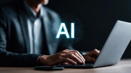 An individual is working on a laptop with an AI graphic representing future technology.