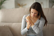 © Antonioguillem - Woman rashing arm after insect bite at home