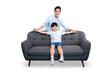 © STOCK88PHOTOGRAPHER - Father and son sit on the sofa happily. The father and son are holding hand with each other