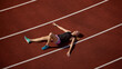 © Lustre Art Group  - Weary athlete resting on track following demanding running exercise session with visible fatigue. Concept of recovery,release of effort, exhaustion after sprint, and athletic endurance.