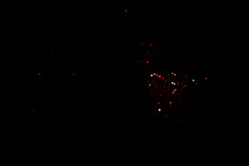 Wall Mural - red blurred bokeh lights on black background. glitter sparkle confetti for celebrate. overlay for yo