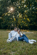 © andrew_shots - Young couple relax at nature at summer