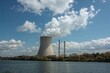 © The 2R Artificiality - White steam clouds released from a nuclear facility's cooling tower, showcasing zero CO2 emissions and promoting a sustainable future through scientific innovation