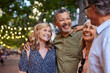© Rido - Mature women and men laughing together