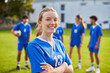 © Rido - Young athlete girl smiling at football field