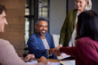 © Rido - Successful business handshake at office