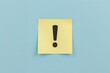 © BlockBrushstrokes - Caution symbol featuring exclamation point on a yellow note against a blue backdrop