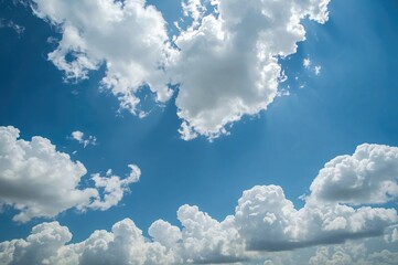 Wall Mural - Fluffy clouds drifting across the blue sky