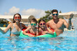 © New Africa - Happy family in swimming pool. Summer vacation
