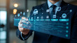 © Wasim - Businessman Interacting with Holographic Interface Showing Data and Icons
