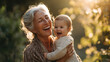 © Ps_Studio21 - Grandmother holding baby grandchild laughing warm sunlight outdoors joyful and loving moment captured family bond happiness nature smiling face tender embrace sunny day childhood affection close