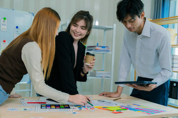 a team of developers collaborates to plan uxui designs, working on wireframes for website and mobile