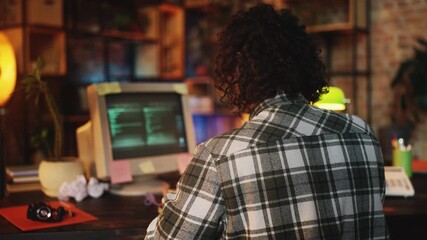 Male IT specialist creating program on computer in 90s office, software founder