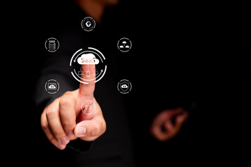 a hand interacts with digital icons representing saas, highlighting technology and software solution
