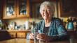© Volha - Senior Woman Taking Daily Medication with Water Morning