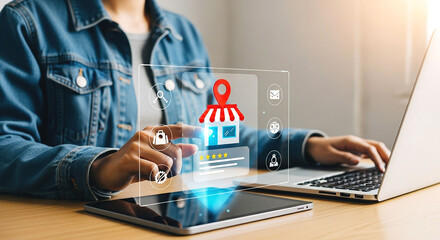 Person using laptop and tablet with online store interface overlay for business applications shown clearly