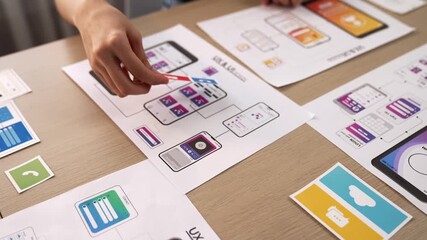 Wall Mural - panorama video of startup company employee planning on user interface prototype for mobile applicati