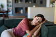 © Lumos sp - Portrait of a  young woman sleeping napping on sofa and relaxing at home