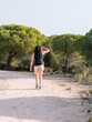 © javidestock - Woman searching for direction on a path in nature