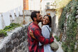 © Novak - Happy couple enjoying a romantic moment outdoors, hugging and smiling in an old European stone street
