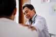 © Gatot - Doctor Touching Patient's Shoulder, Expressing Empathy and Support at Medical Appointment