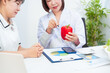 © M+Isolation+Photo - Professional Asian female nutritionist giving nutritional counseling to female patient sitting at clinic table discussing diet, health goals, meal plans and strategies for long-term wellness