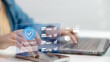 © FAMILY STOCK - Close up hand using smartphone with digital secure payment icon. Concept of online transaction, mobile banking, e-commerce shopping, financial technology, and safe digital payment verification system.