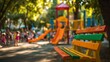 © TyliJura - playground equipment in public park with wooden bench and blurred children playing outdoors in summer