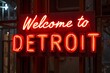 Neon “Welcome to Detroit” glowing in industrial rust setting.
