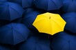 © Pixels Hunter - Bright yellow umbrella standing out among dark blue umbrellas on a seamless background, symbolizing individuality and uniqueness concept.