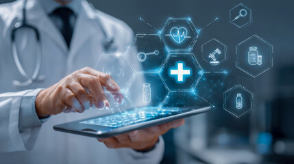 Doctor using digital tablet with medical icons, futuristic concept of medical technology and telemedicine