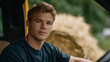 © forenna - a farm road with tractors and crops, cluttered with hay bales, soft natural light from the sun, a young man in a truck hauling, natural poses as he drives, detailed textures on the